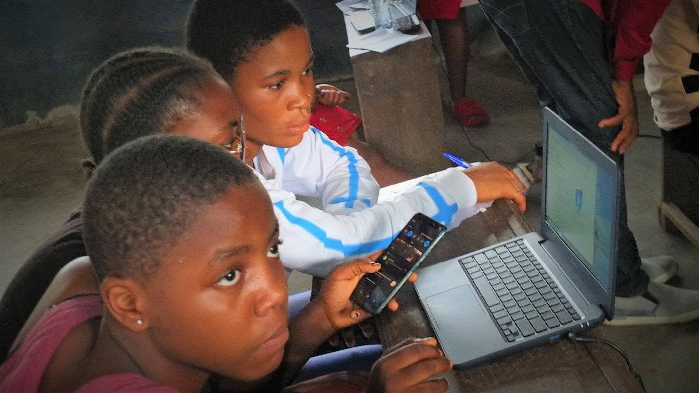 Children learning with a laptop